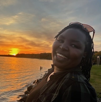 Image of Roseline with the sunset with the beach in the background